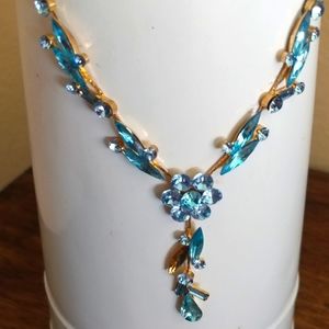 Goldtone dangle necklace with blue stones